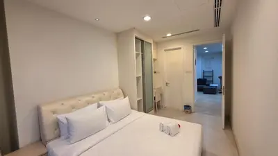 a bedroom with a white bed with white pillows at KLCC Binjai 8 Premium Soho Apartment by prime suites in Kuala Lumpur