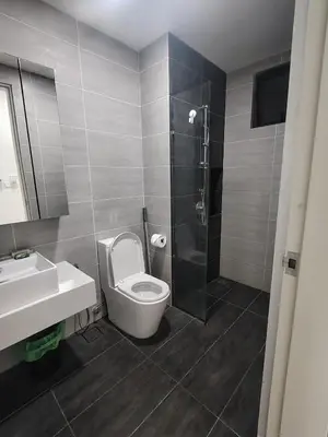 a bathroom with a toilet and a sink and a shower at Trion Residence Kuala Lumpur by Centrix in Kuala Lumpur