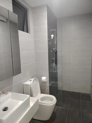a bathroom with a toilet and a sink and a shower at Trion Residence Kuala Lumpur by Centrix in Kuala Lumpur