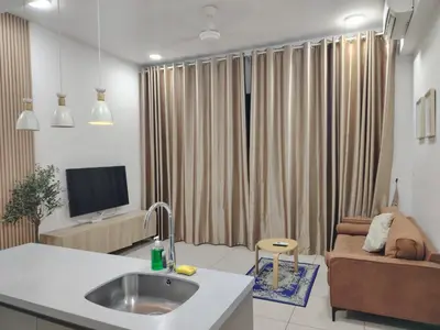 a kitchen and living room with a sink and a couch at Trion Residence Kuala Lumpur by Centrix in Kuala Lumpur