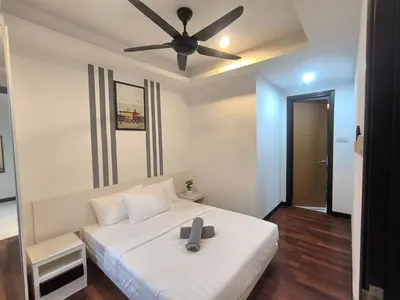 a bedroom with a white bed with a ceiling fan at 013A2 Casa Residency- Sweet Home 2R 2B in Kuala Lumpur