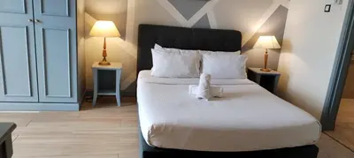 a bedroom with a bed with a stuffed animal on it at KL City Tour Residence Berjaya Times Square in Kuala Lumpur