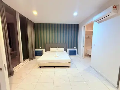 a bedroom with a bed in the middle of it at Platinum Suites Kuala Lumpur BY NOVA in Kuala Lumpur