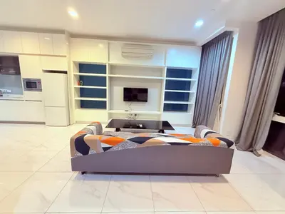 a living room with a couch and a tv at Platinum Suites Kuala Lumpur BY NOVA in Kuala Lumpur