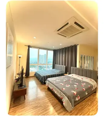 a bedroom with two beds and a television in it at Setapak Central Mall Bathtub & Netflix in Kuala Lumpur