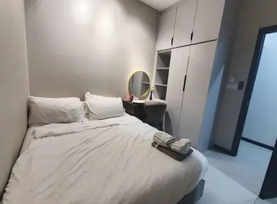 a bedroom with a large bed with a mirror at Mini studio with own private bathroom, free Wi-Fi in Kuala Lumpur