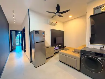 a kitchen with a washer and dryer in a room at Neu suite, Family Unit - Jelatek LRT Gleneagles Hospital in Kuala Lumpur
