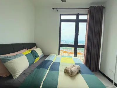 a bedroom with a bed with a large window at Neu suite, Family Unit - Jelatek LRT Gleneagles Hospital in Kuala Lumpur