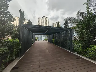 a wooden walkway with a black bridge in a city at 1-4pax, Spacious Studio, Jalan Ipoh KL The Pano in Kuala Lumpur