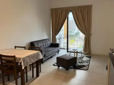 a living room with a couch and a table at 1-4pax, Spacious Studio, Jalan Ipoh KL The Pano in Kuala Lumpur