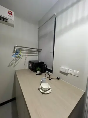 a kitchen with a counter with a plate on it at Neu Suite small studio with own private bathroom free wifi Deposit RM200 in Kuala Lumpur