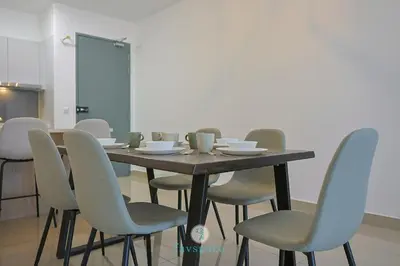 a dining room table with chairs and a table at 15min to Mid Valley - M Arisa Sentul KL for 5 in Kuala Lumpur