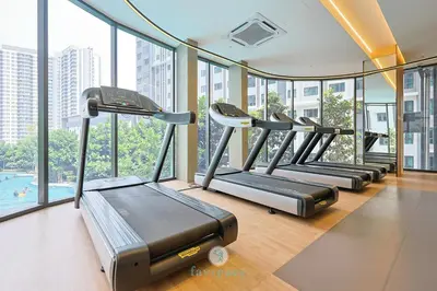 a row of treadmills in a gym with windows at 15min to Mid Valley - M Arisa Sentul KL for 5 in Kuala Lumpur