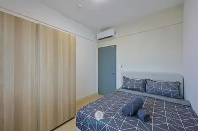 a bedroom with a blue teddy bear laying on a bed at 15min to Mid Valley - M Arisa Sentul KL for 5 in Kuala Lumpur