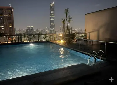a swimming pool on top of a building with a city skyline at Luxury Fairlane Residence Suites Kuala Lumpur by AZI BNB in Kuala Lumpur