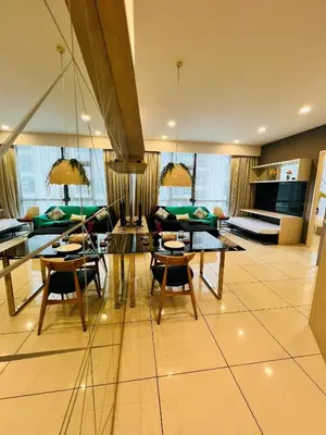 a living room with a table and chairs and a couch at FA Suits KL BY ROBERTSON in Kuala Lumpur