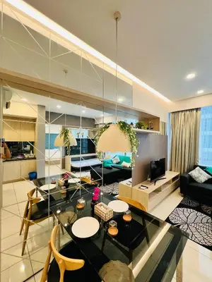 a living room with a glass table and a couch at FA Suits KL BY ROBERTSON in Kuala Lumpur