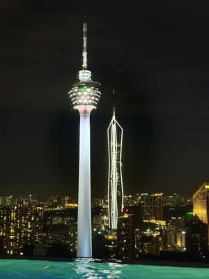 a view of the space needle at night at The platinum KLCC by suites hospitality in Kuala Lumpur