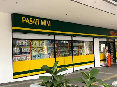 a pizzamax store with a yellow and green facade at Trion Hotel by HAVENZA near TRX, Time Square and Bukit Bintang in Kuala Lumpur