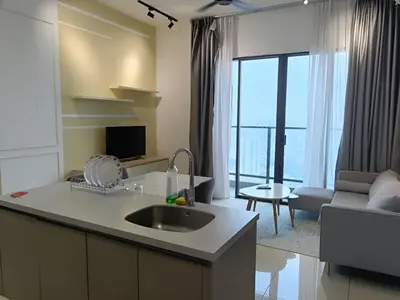 a kitchen with a sink and a living room at Trion Hotel by HAVENZA near TRX, Time Square and Bukit Bintang in Kuala Lumpur