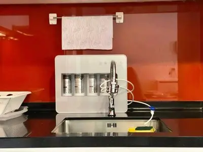 a kitchen counter with a sink and a mixer at Max 5pax, Muji Style Apartment Arcoris Mont Kiara in Kuala Lumpur