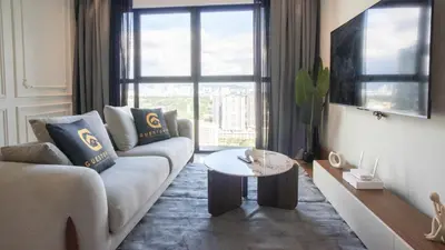 a living room with a couch and a table at Alfa Bangsar by Guestonic in Kuala Lumpur