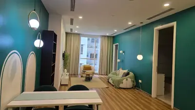 a living room with blue walls and a green wall at Binjai 8 KLCC Premium Soho By Prime Suites in Kuala Lumpur