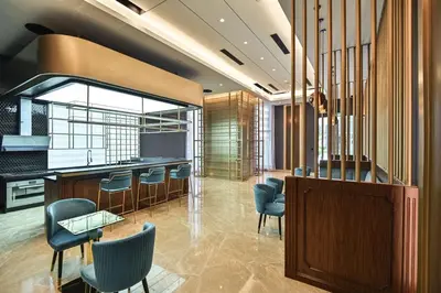 a lobby with chairs and a bar in a building at Star Residence Heart of KLCC in Kuala Lumpur
