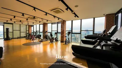 a gym with treadmills and cardio equipment in a building at Ceylonz Premium Suites KLCC by BYON in Kuala Lumpur