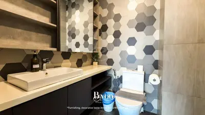 a bathroom with a sink and a toilet at Ceylonz Premium Suites KLCC by BYON in Kuala Lumpur