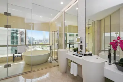 a bathroom with a large tub and a large window at Bodhi Banyan Pavilion Kuala Lumpur by WSD in Kuala Lumpur
