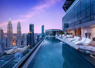 a pool on top of a building with a city skyline at Imperial KLCC by WSD in Kuala Lumpur