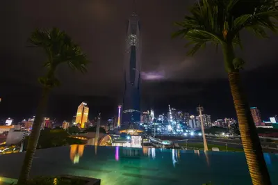 a view of the burj khalifa at night at Opus Kuala Lumpur by WSD in Kuala Lumpur