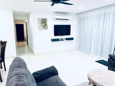 a living room with a couch and a tv at Apartment in bukit bintang in Kuala Lumpur