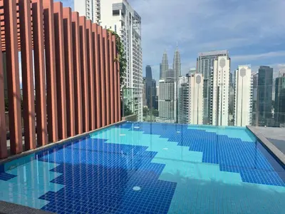 a large swimming pool on the roof of a building at Luxury suite for couple 267A at KLCC in Kuala Lumpur
