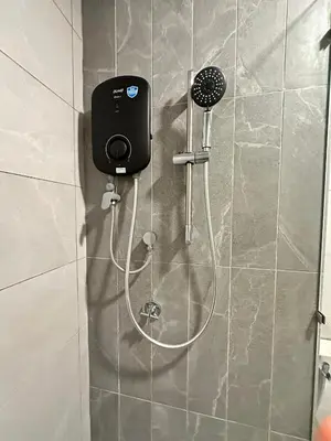 a shower in a bathroom with a shower head at Luxury suite for couple 267A at KLCC in Kuala Lumpur