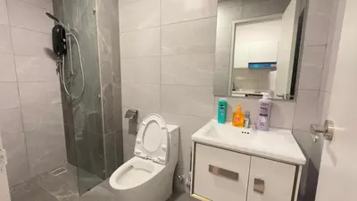a bathroom with a toilet and a sink and a shower at Luxury couple suite 23A3A at Majestic Residence in Kuala Lumpur