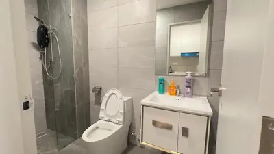 a bathroom with a toilet and a sink and a shower at Luxury couple suite 23A3A at Majestic Residence in Kuala Lumpur