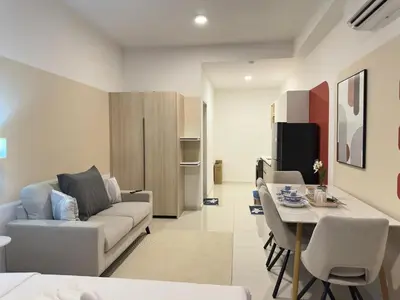 a living room with a couch and a table at Luxury studio for couple 267B at KLCC in Kuala Lumpur