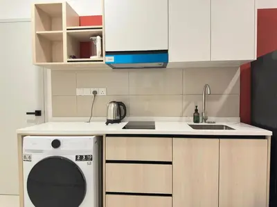 a kitchen with a washing machine and a sink at Luxury couple suite 251B at KLCC in Kuala Lumpur
