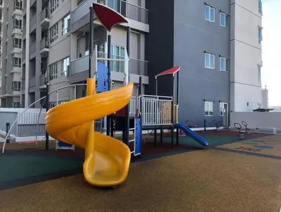 a playground with a slide in front of a building at RC Balqis Homestay in Kuala Lumpur