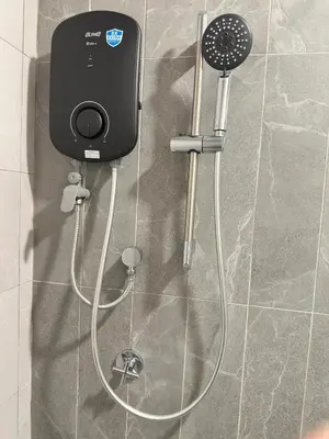 a shower with a blow dryer in a bathroom at Cozy couple suite 23A3B at KLCC in Kuala Lumpur