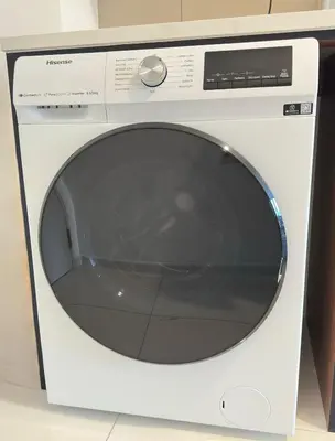 a white microwave oven sitting on top of a counter at Cozy couple suite 23A3B at KLCC in Kuala Lumpur
