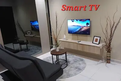 a living room with a flat screen tv on a wall at Datum Jelatek SKY Ring VIP Nice View in Kuala Lumpur