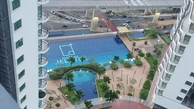 an overhead view of a swimming pool in a building at Datum Jelatek SKY Ring VIP Nice View in Kuala Lumpur