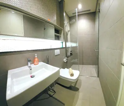 a bathroom with a sink and a toilet and a shower at Lucentia Residence Infinity swimming pool BY Lalaport in Kuala Lumpur