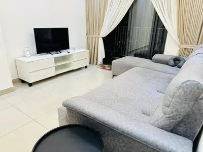 a living room with two couches and a flat screen tv at Sentul Home Condo-KLCC View with 3bed,3bath, cooking allowed in Kuala Lumpur