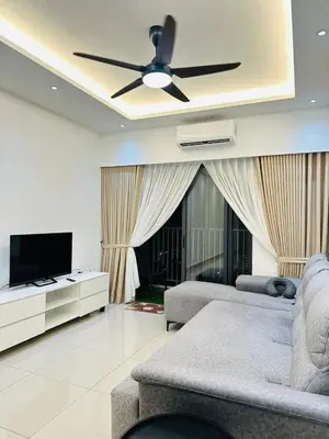a living room with a couch and a ceiling fan at Sentul Home Condo-KLCC View with 3bed,3bath, cooking allowed in Kuala Lumpur