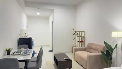 a living room with a couch and a table at Luxury copule suite 232A at KLCC in Kuala Lumpur