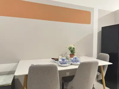 a dining room with a table and chairs at Luxury studio suite 277A at KLCC in Kuala Lumpur